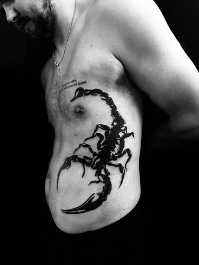 Get a striking blackwork scorpion tattoo by the talented artist Oliver Soames for a bold and unique look. Perfect for those who embrace the darker side of tattoo art.