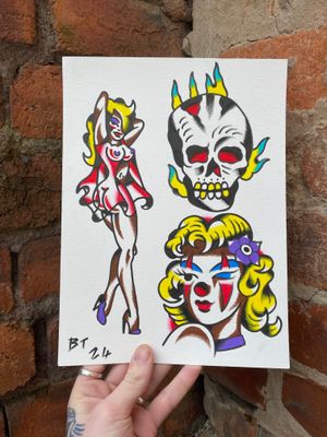 Traditional colour flash or a skull on fire, a clown lady head and a pin up 