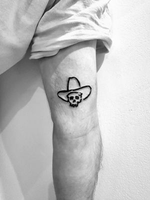 Get an edgy and unique blackwork cowboy skull tattoo by artist Oliver Soames. Perfect for lovers of the wild west and dark aesthetics.