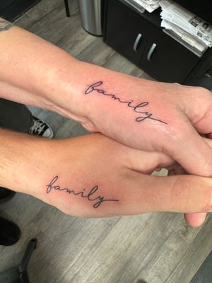 Get a delicate and sophisticated tattoo by Ronny East with small lettering in fine line style.