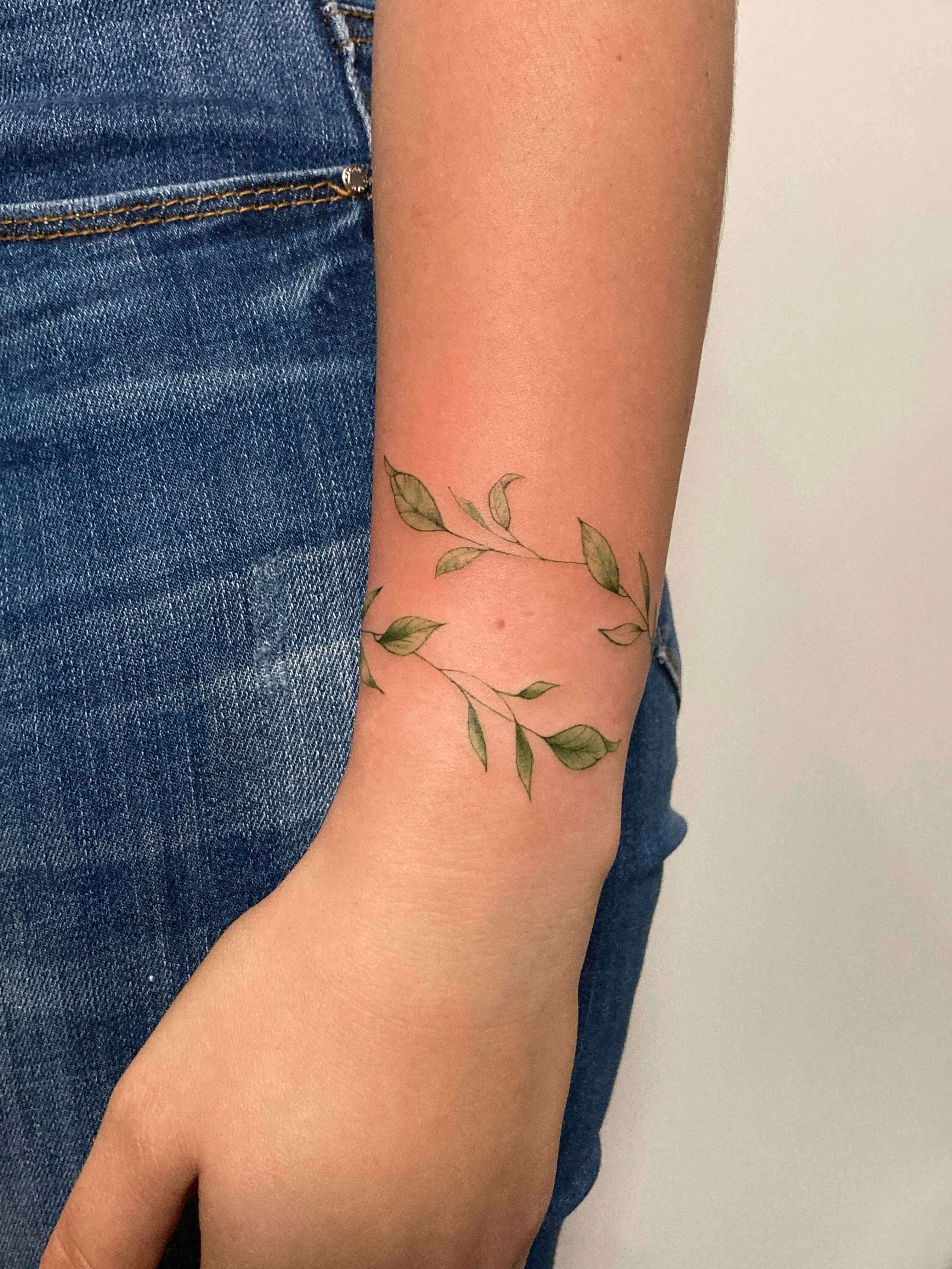 Freehand magnolia tattoo located on the forearm.