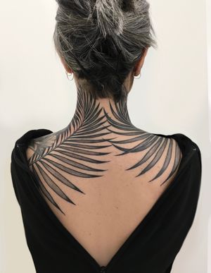 Immerse yourself in nature with this striking blackwork tattoo featuring a beautifully detailed vine and leaf design by the talented Giada Knox.