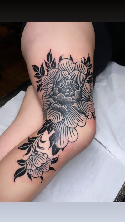 Embrace the beauty of blackwork and dotwork with this stunning flower tattoo by Giada Knox.