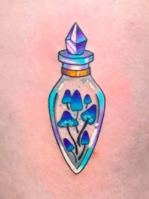 I absolutely love this tattoo. I'm a collector of all things mushrooms and random glass bottles. It's beautiful. 