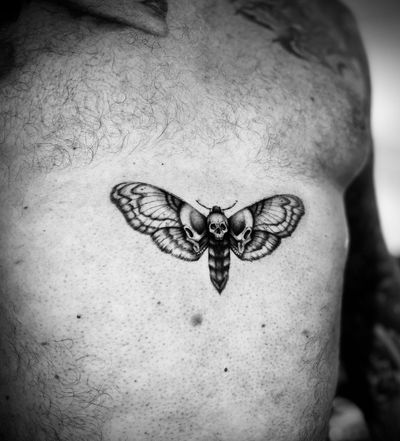 Experience the haunting beauty of micro_realism with this intricate moth and death motif by talented artist Georgina.