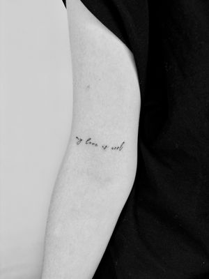 Get a beautifully delicate tattoo with small lettering, expertly done by Ruth Hall for a timeless look.