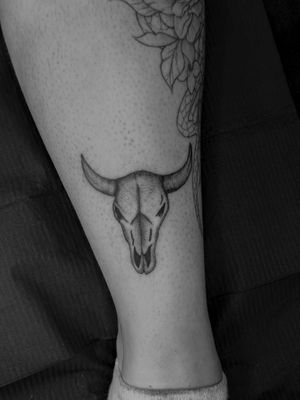 Explore the dark and detailed world of black and gray dotwork with this illustrative skull tattoo crafted by renowned artist Oliver Soames.