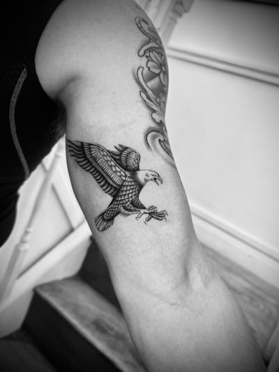 Get inked with a stunning illustrative eagle design by the talented artist Georgina. Fly high with this fierce and powerful tattoo!