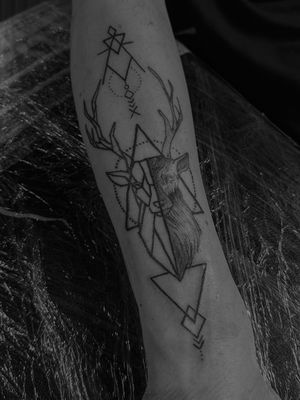 Unique geometric and illustrative design featuring a deer and rune motifs. Expertly crafted by renowned tattoo artist Oliver Soames.