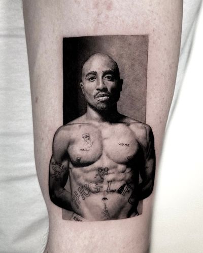 Get a stunning black and gray tattoo of Tupac by the talented Jay Soze. Perfect for any Tupac fan!