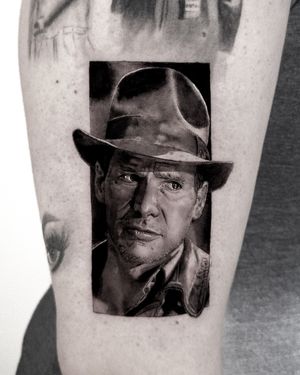 Capture the likeness of Indiana Jones himself in stunning black and gray realism by artist Jay Soze.
