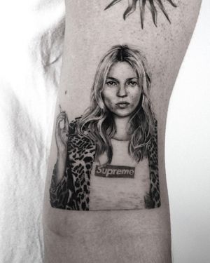 Get a stunning black and gray realism tattoo of model Kate Moss, done by the skilled artist Jay Soze.
