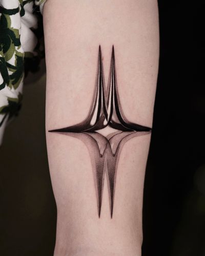 Experience the magic of micro-realism with this black and gray metallic star tattoo by the talented artist Gloria Gu.