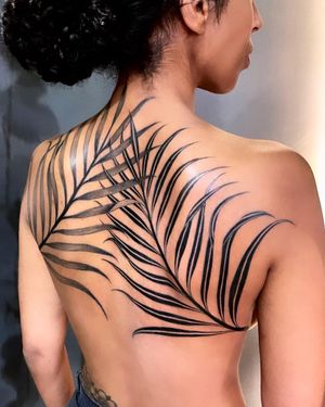 Embrace the beauty of nature with this intricate blackwork tattoo featuring vines, leaves, and plants by Giada Knox.