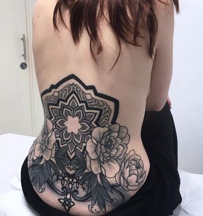 Unique blackwork and dotwork design by Giada Knox, combining intricate geometric patterns with a delicate floral motif.