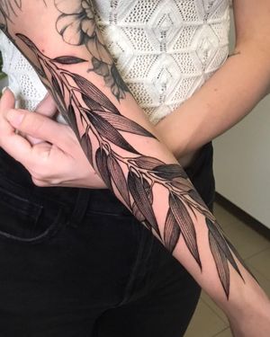 Experience the beauty of nature with this intricate leaf and plant design by the talented artist Giada Knox. Perfect for those who appreciate detailed blackwork tattoos.