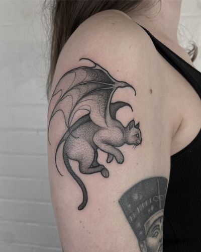Adorn your skin with a unique illustrative tattoo featuring a devilish cat design by Claudia Smith.