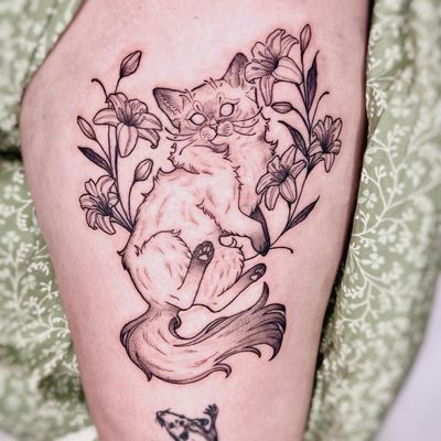 Check out this stunning blackwork cat tattoo by the talented Michelle Harrison. A beautiful and unique design for any cat lover.