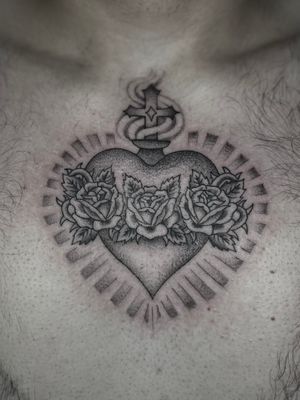 Experience the beauty of a black and gray sacred heart tattoo by the talented artist Liam Harbison.