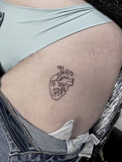 Elegant and detailed heart design by renowned artist, perfect for a minimalist yet meaningful tattoo.