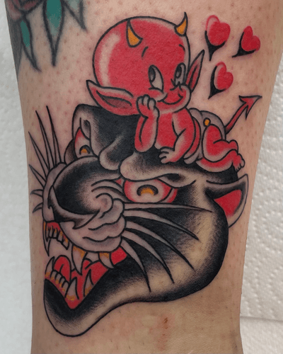 Get inked with a fierce combination of a panther and devil design by the talented artist Liam Harbison. Embrace the dark and mysterious allure of this traditional tattoo.