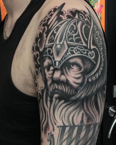Detailed black and gray Norse tattoo of Odin, showcasing Liam Harbison's skill in illustrative style.