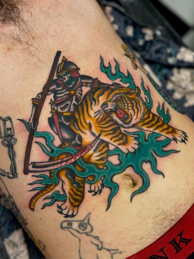 Unique combination of tiger, knight, and skeleton motifs in a traditional style by Liam Harbison.