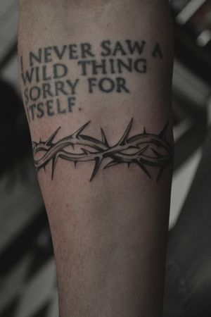 A stunning black and gray illustrative tattoo of intricate thorns, expertly done by Liam Harbison.
