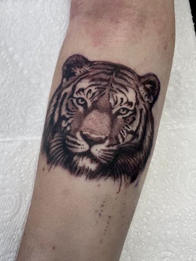 Embrace strength & power with this stunning tiger design by the talented artist Liam Harbison.