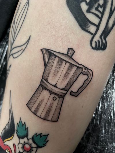 Get a taste of Italy with this illustrative tattoo by Liam Harbison, featuring a delicious cup of mocca coffee.