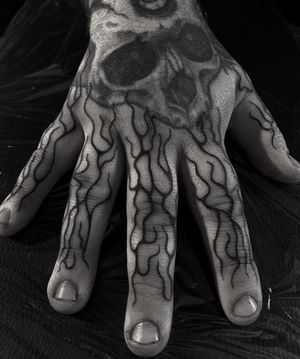 Experience the intensity of blackwork flames in this stunning tattoo by talented artist Sophia Hayes.