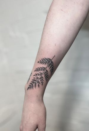 Experience the beauty of dotwork and handpoke techniques in this unique fern design by Marketa.handpoke.