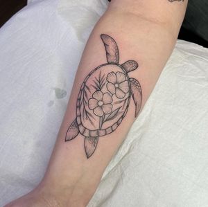 Get a stunning illustrative turtle design done by the talented artist Chris Harvey. This unique tattoo will make a statement and stand out.