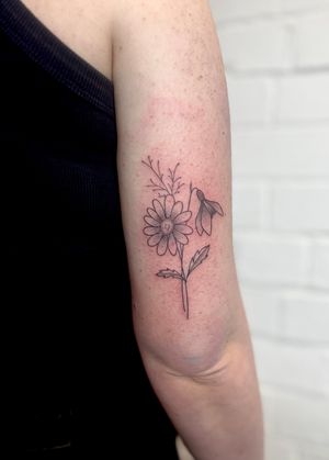 Beautiful hand-poked floral design by Marketa.handpoke, featuring intricate dotwork and fine lines.