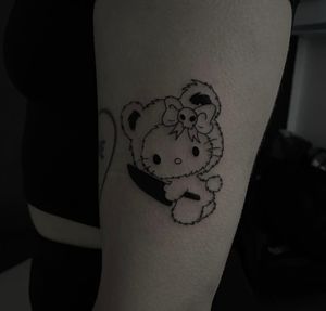 Get inked by Sophia Hayes with this cute and vibrant Hello Kitty design, perfect for all ages!