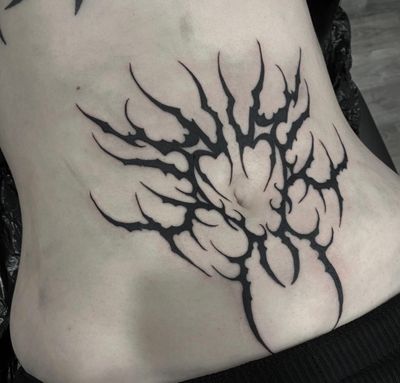 Experience the fusion of ancient tribal aesthetics with modern cyber sigilism in this striking blackwork tattoo by Sophia Hayes.