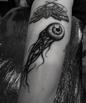 Experience the mystique with this stunning blackwork eye tattoo, brought to life by the talented artist Sophia Hayes.