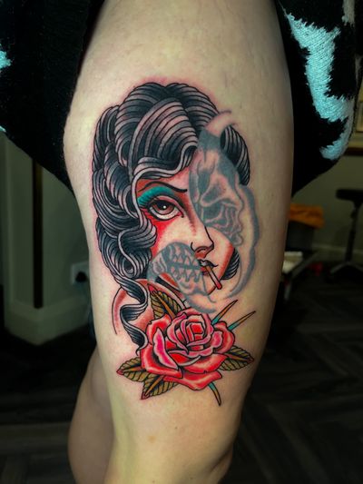 Get a stunning traditional tattoo featuring a lady and skull motif, expertly done by renowned artist Barney Coles.