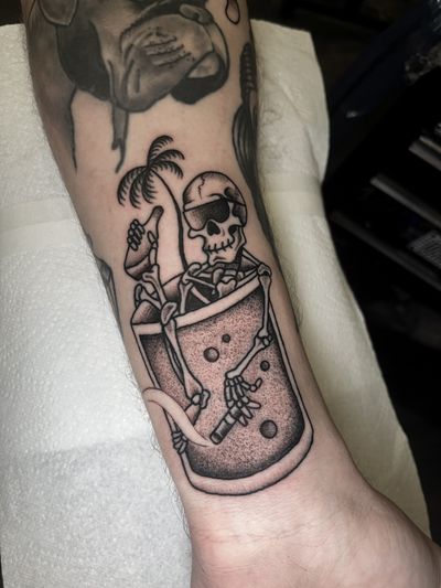 Unique dotwork and traditional style tattoo featuring a skull, drink, and skeleton by Barney Coles.