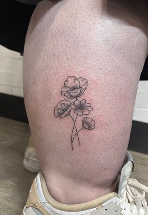 Embrace nature with a delicate hand-poked flower tattoo in intricate dotwork style by Marketa.handpoke.