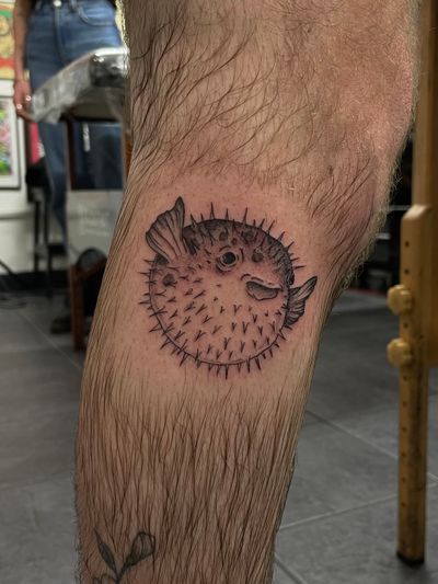 Get a stunning illustrative pufferfish tattoo by the talented artist Julia Bertholdi. Stand out with this unique and detailed design.