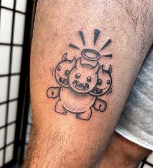 Illustrative tattoo merging Radiohead vibe with adorable monster motif. By Jonathan Glick.