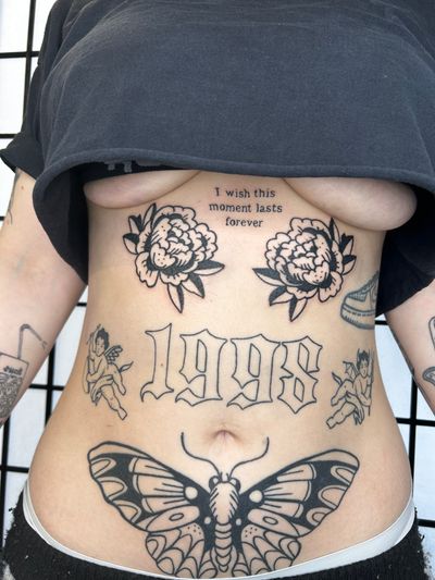 Small traditional lettering tattoo by Jonathan Glick featuring a beautiful design of butterfly and flower patchwork.