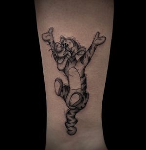 Illustrative black and gray tattoo of Tigger from Winnie the Pooh, by Kateryna Goshchanska. Playful and nostalgic design.