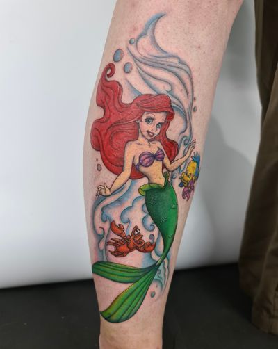 Explore the magic of the sea with this enchanting Ariel tattoo, beautifully illustrated by Kateryna Goshchanska.