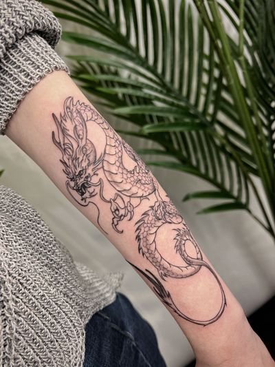 Get inked with a stunning illustrative dragon tattoo by the talented artist Kateryna Goshchanska. Embrace the power and grace of this mythical creature.