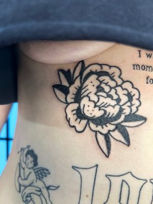 Unique blackwork flower tattoo by Jonathan Glick, featuring intricate detailing and creative design.