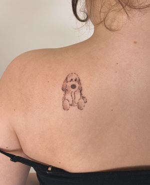 Adorable fine line tattoo of a cute dog by Chloe Hartland, featuring delicate details.