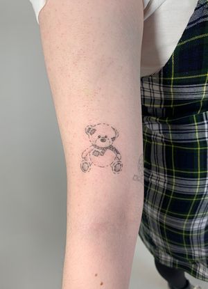 Admire the fine line and illustrative details of this stunning teddy bear tattoo by Chloe Hartland. The delicate design is sure to charm and captivate.