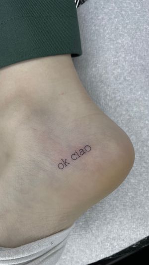 Small script , on foot , fine line tattoo